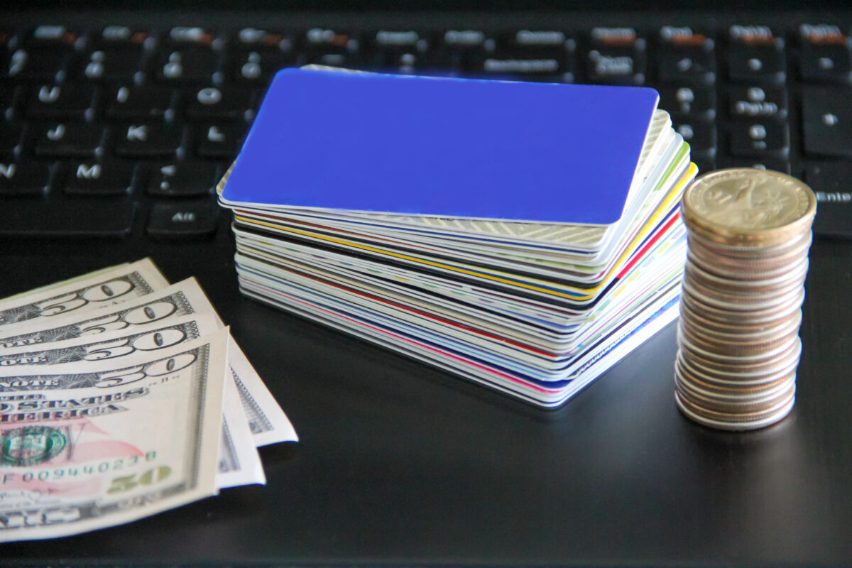 credit-cards-and-coins-pile-with-fifty-dollar-bill-2022-10-10-15-51-42-utc-1200×800